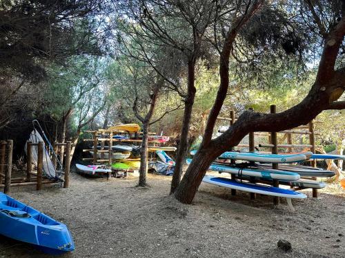 a group of slides and kayaks in a playground at BADINE BEACH piscine balnéo clim in Hyères