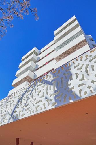 a building with metal cladding on top of it at Hesperia Sevilla in Seville