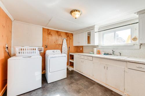 a kitchen with a white refrigerator and a sink at Pet-Friendly North Carolina Abode - Deck and Hot Tub in Concord