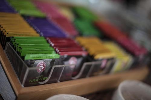 a pile of colorful toothbrushes sitting on a shelf at Hotel am Park - Krefeld - Düsseldorf in Willich