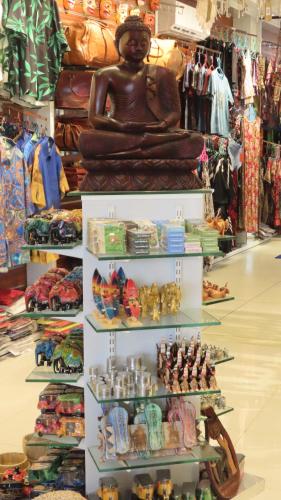a statue of a woman on a shelf in a store at Surf View Resort in Ahangama