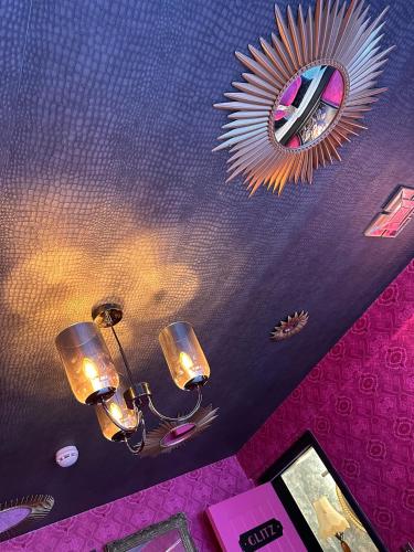 a room with a ceiling with a mirror and lights at Kip 23 JJs Emsworth in Emsworth