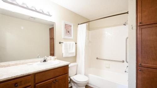 a bathroom with a sink and a toilet and a shower at Landing Modern Apartment with Amazing Amenities (ID8272X47) in Birmingham