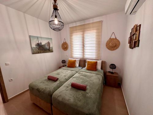 Кровать или кровати в номере Anemos Villa Stegna
