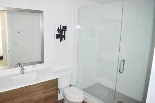 a bathroom with a shower and a toilet and a sink at Landing Modern Apartment with Amazing Amenities (ID746) in Fort Lauderdale