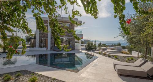 an image of a house with a swimming pool at Elia Cove Luxury Villa with private Pool in Loutraki