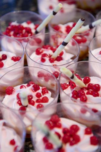 a group of cups filled with desserts with cherries in them at H10 Ocean Suites in Corralejo