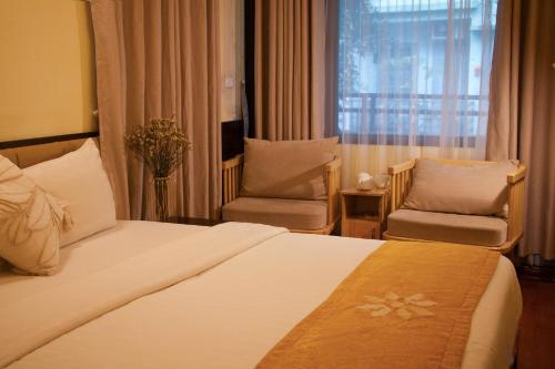 Ein Bett oder Betten in einem Zimmer der Unterkunft Hanoi Family Homestay