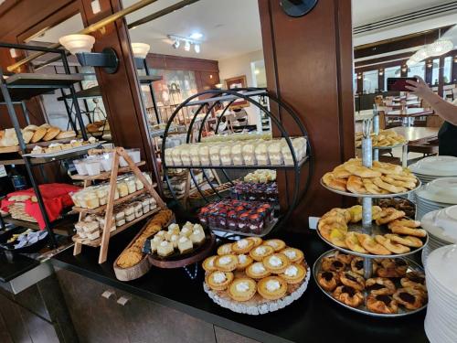 a bakery with a bunch of different types of pastries at Mayaguez Resort & Casino in Mayaguez
