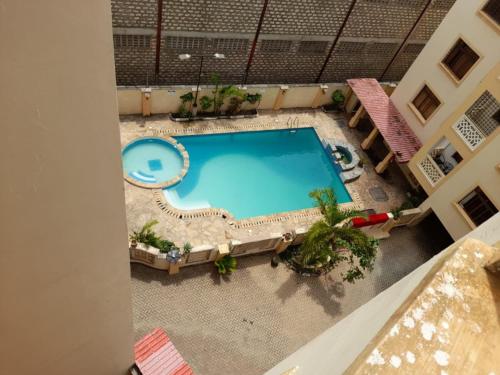 an overhead view of a swimming pool in a building at Serena Beach View Apartment in Mombasa