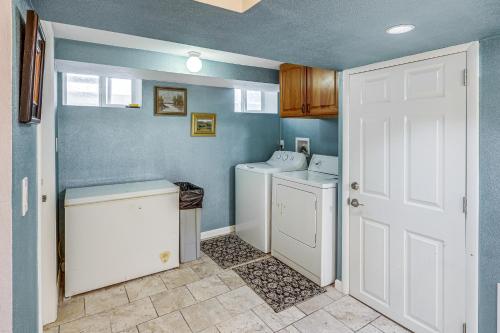 a laundry room with a washer and dryer at Billings Home with Trampoline, Gas Grill and Fire Pit! in Billings