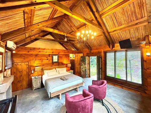Postel nebo postele na pokoji v ubytování Chamarel Mountain chalets