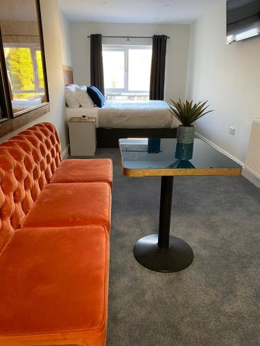 a living room with a couch and a table at 53 Luxury Accommodation in Maynooth