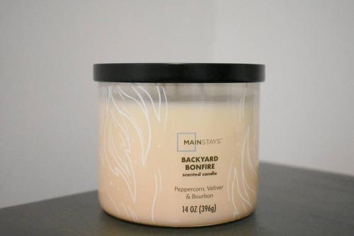 a jar of a candle sitting on a table at Arctic 415 in Grand Rapids