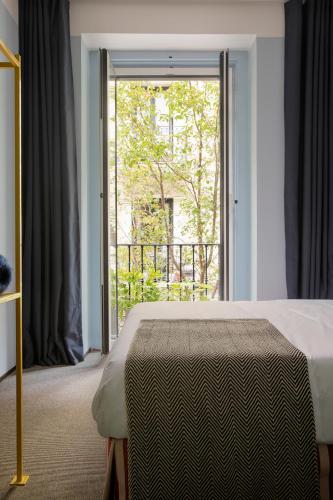 Ένα ή περισσότερα κρεβάτια σε δωμάτιο στο Armesto Rooms