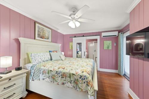 a bedroom with a bed and a ceiling fan at The Homestead B&B in Rehoboth Beach