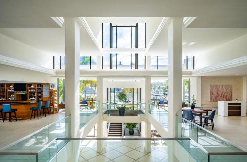 an open lobby with glass floors and chairs and tables at Hyatt Regency Sarasota in Sarasota