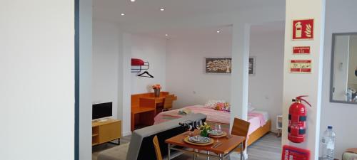 a living room with a couch and a table at Vista Funchal Ⅰ in Funchal
