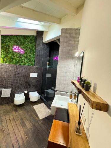 a bathroom with a toilet and a sink at BRIDGE Apt Brescia - Netflix - wifi in Brescia