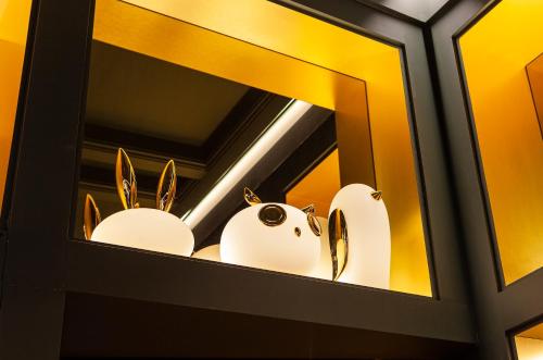 a cabinet with two white animals in it at Art Legacy Hotel Baixa-Chiado in Lisbon