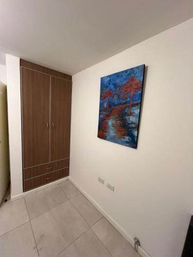 a painting hanging on a wall in a room at Del Camino. Hospedaje Temporal in Zapala