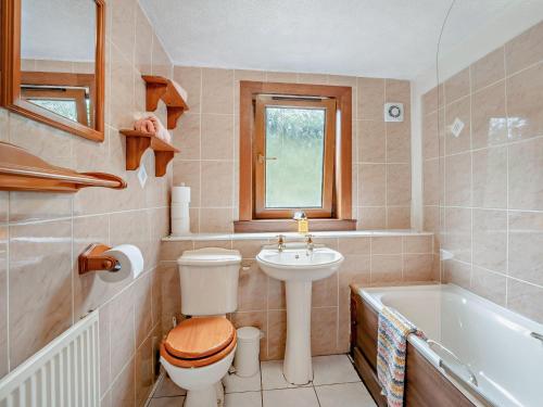 a bathroom with a toilet and a sink and a tub at 2 bed property in Edinburgh 53898 in Edinburgh