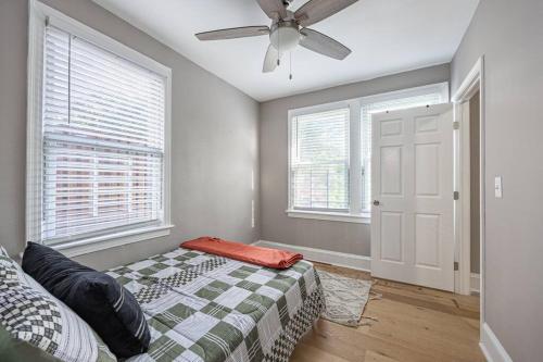 a bedroom with a bed and a ceiling fan at NEW Updated 2BR Apartment in DC in Washington