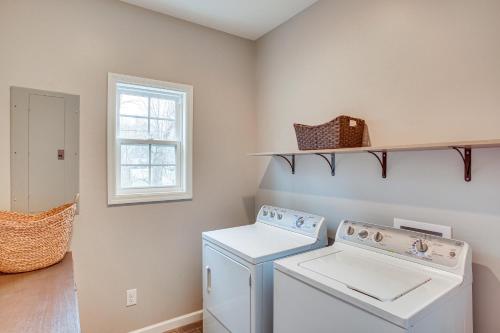 a laundry room with a washing machine and a window at Winchester Home with Deck Less Than 1 Mi to Tims Ford Lake! in Winchester