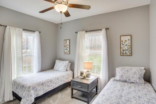 a bedroom with two beds and a ceiling fan at Winchester Home with Deck Less Than 1 Mi to Tims Ford Lake! in Winchester