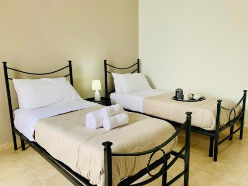 Ліжко або ліжка в номері Tre Balconi - Casa Vacanza Salento