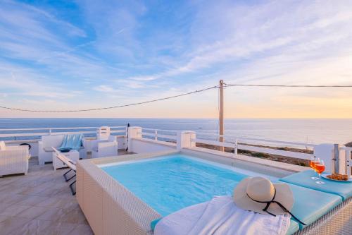 a swimming pool on a balcony with a view of the ocean at Villa Monteduro - Leuca in Leuca