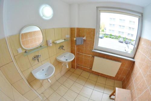 a bathroom with a sink and a mirror at Noclegi Bytom - OPAL in Bytom