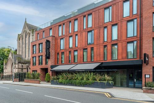 a red brick building on a city street at Hotel Indigo - Chester, an IHG Hotel in Chester