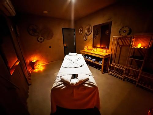 a room with a bed and a mirror in it at Wolf Of The City Hotel & Spa in Antalya