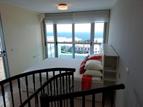 En eller flere senge i et værelse på Super Penthouse Ocean View