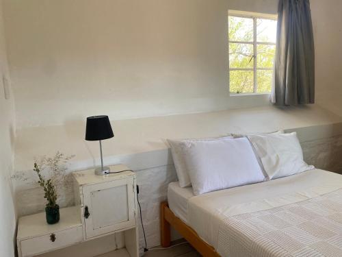 Ένα ή περισσότερα κρεβάτια σε δωμάτιο στο Dwarsvlei Guest Farm
