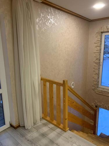 a room with a staircase and a window at Ехо Тростяну in Slavske