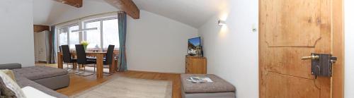 a living room with a couch and a table at Appartement De Luxe - 140m² in Elbigenalp