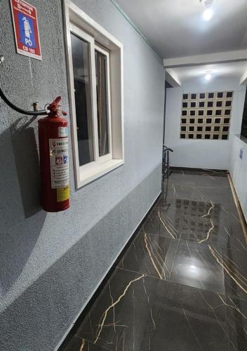a fire hydrant is sitting on the side of a room at BOB Suítes in Porto De Galinhas
