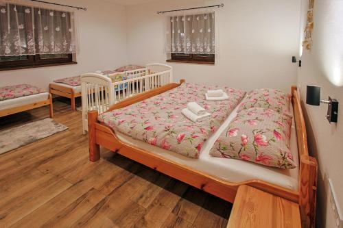 a bedroom with two beds in a room at Chata Liptov, Domček v záhradách in Liptovská Osada