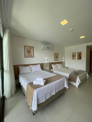 Postel nebo postele na pokoji v ubytování Flat Eco Resort Praia Dos Carneiros