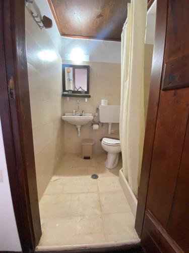 a bathroom with a toilet and a sink at Belessi's Mansion 1 in Monemvasia