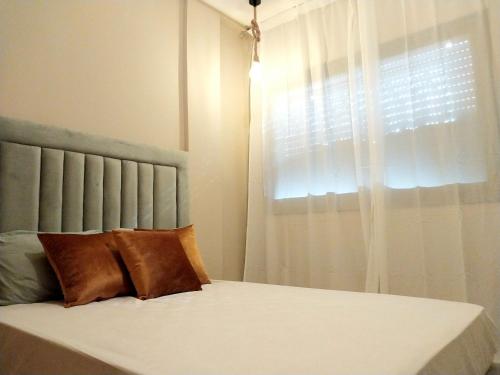 Postel nebo postele na pokoji v ubytování Appart relax aéroport 5 min