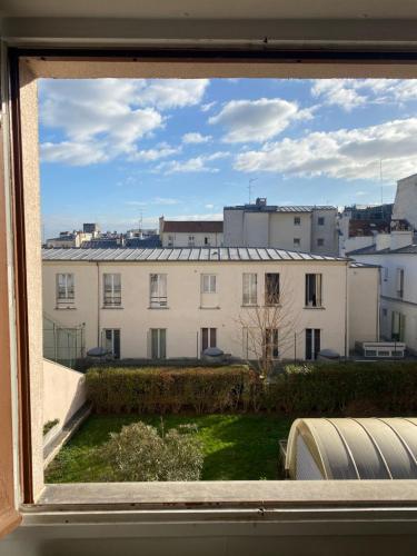 a view from a window of a building at Apartment in Montmartre in Paris