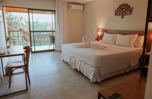 Ένα ή περισσότερα κρεβάτια σε δωμάτιο στο Hotel Fazenda sol nascente