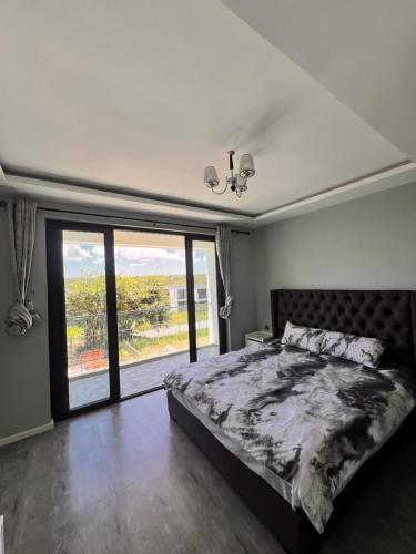 Llit o llits en una habitació de Fabz Apartment
