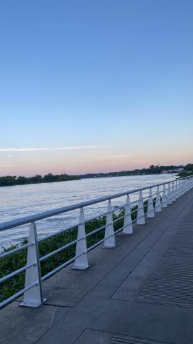 a row of white cones on a pier near the water at Departamento del Río in Paraná