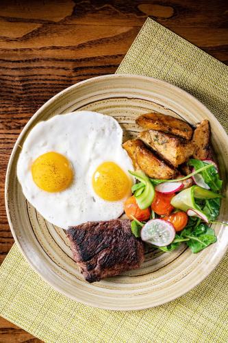 a plate of food with eggs and meat and a salad at Grand Hyatt Washington in Washington