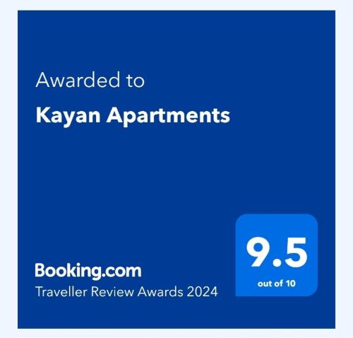 Et logo, certifikat, skilt eller en pris der bliver vist frem på Kayan Apartments