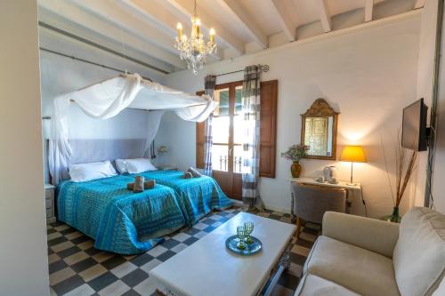 a bedroom with a bed and a table in a room at Ibiza Boutique Guest House in Ibiza Town